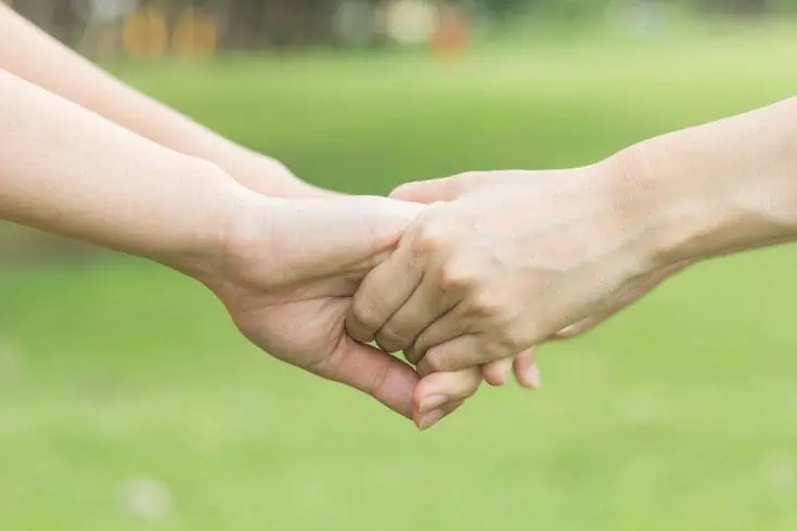 Couple holding hands 