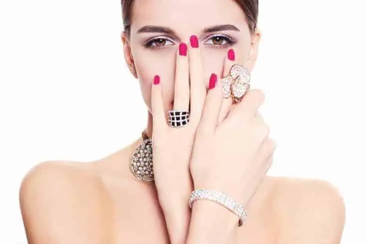 Young glamorous woman covered in jewels