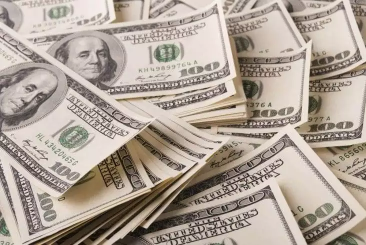 Image of hundred dollar bills on the table