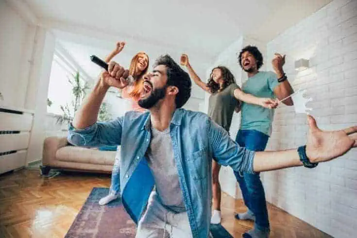 Group of friends playing karaoke