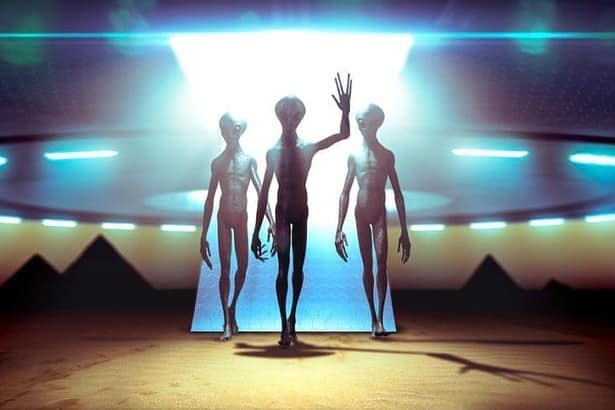 Aliens landing on a UFO