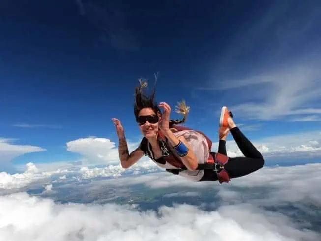 A young woman sky diving