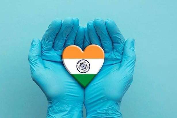 Doctors Hands Wearinh Surgical Gloves Holding India Flag Heart