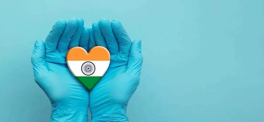 Doctors Hands Wearinh Surgical Gloves Holding India Flag Heart