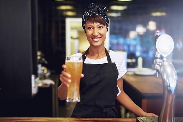 Female waitress selling beer