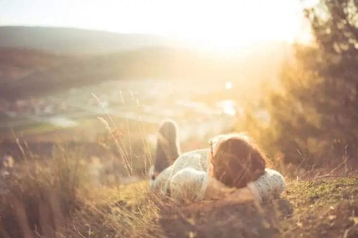 Woman lying on the grass and relaxing