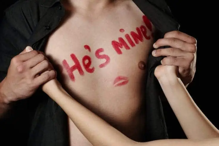 10 Things Only a True Lover Can Feel 2 He's Mine written on a guy's chest with lipstick