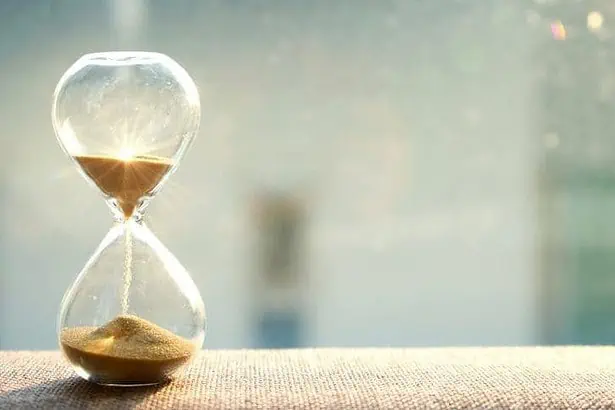 An hourglass against a sunny background