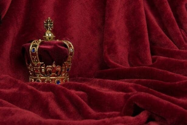 A golden crown placed on a red velvet