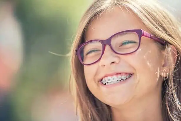 Smiling young girl with braces