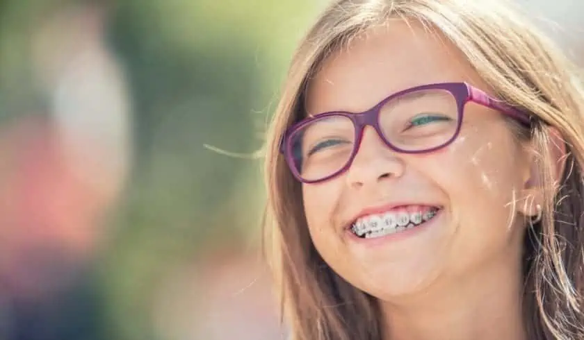 Braces - 11 Worst Things You Experience 1 Smiling young girl with braces