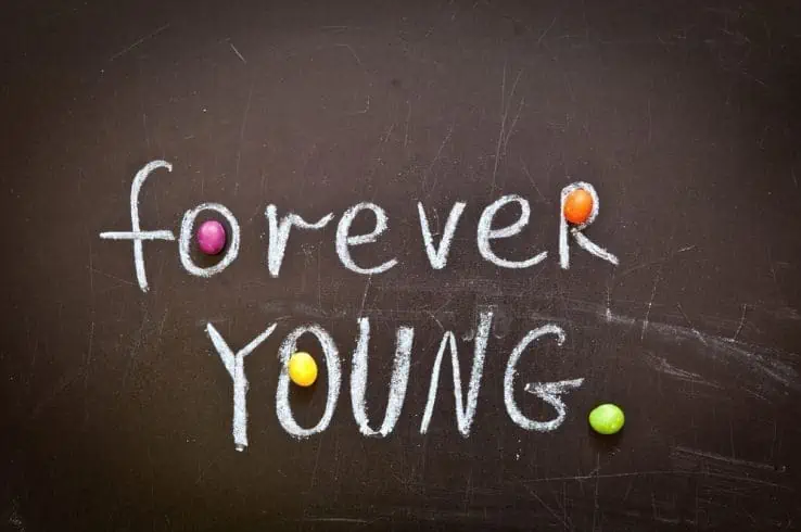 Short Girls: 12 Amazing Perks of Being Short 2 Forever young written on a black board