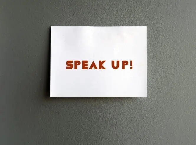 A post it with Speak Up! written on it