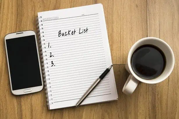Bucket list written on a note pad