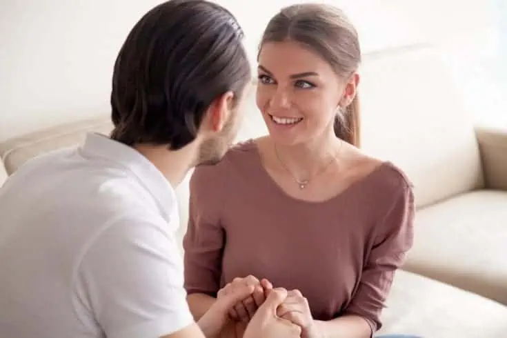 A man holding his partner's hands . 50 first dates