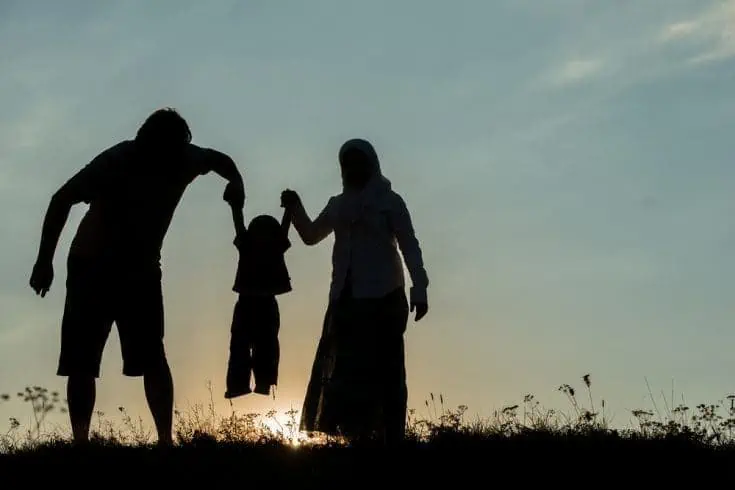 Homecoming Blood - An Exciting Mystery 4 Parents holding their son's hands