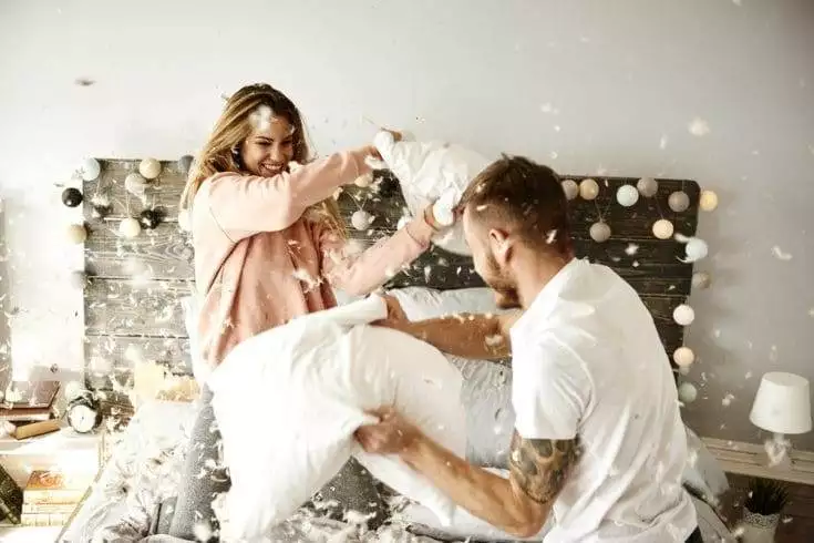 Couple having a pillow fight