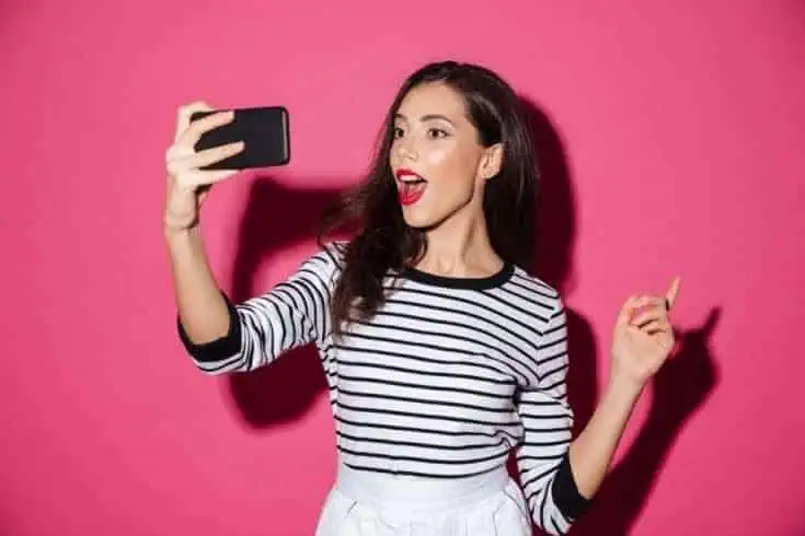 7 Things People Will Tell About Pimples 4 A young beautiful woman taking a selfie