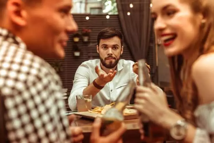 A man third wheeling and feeling left out