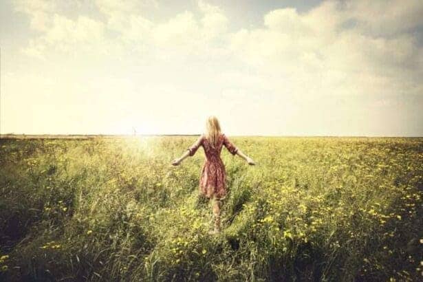 Woman standing in a green field