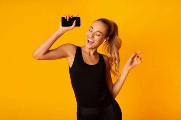 woman wearing earbuds and enjoying music