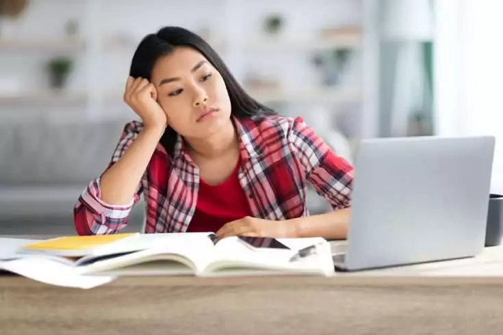 Young student having issue while studying