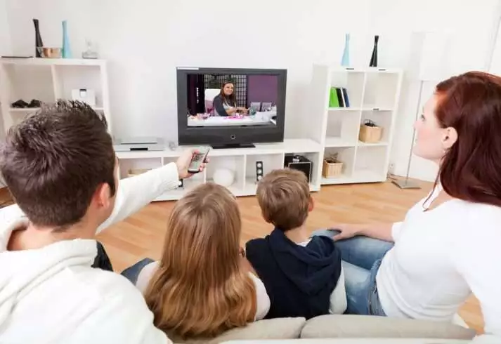 Television- A Cohort or a Fiend 3 Children watching tv with their parents