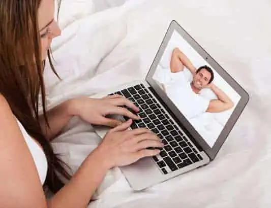 Woman talking over video call with boyfriend