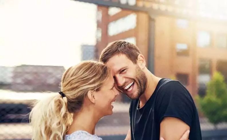 Happy couple laughing together