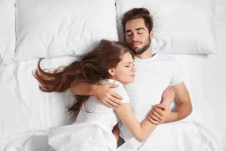 Couple sleeping together