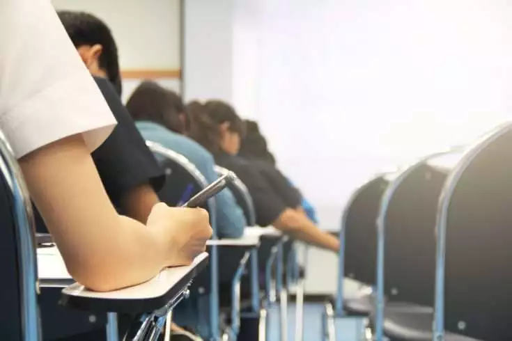 5 Incredible Ways Your Life Changes After College 3 students giving exam. after college