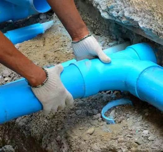 Drainage pipe being fixed.