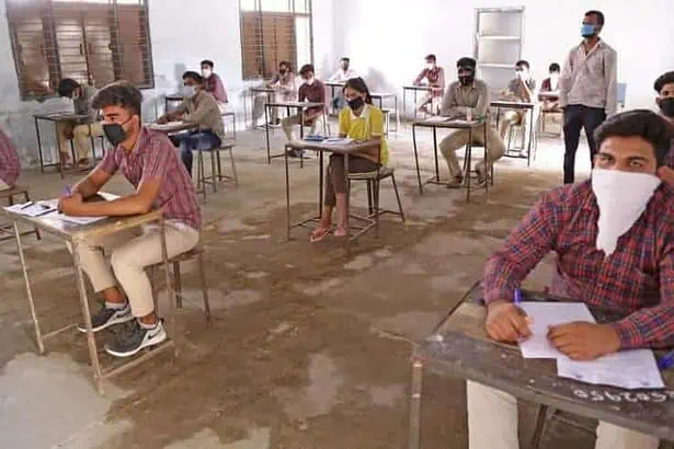 Students giving exams while maintaining social distance