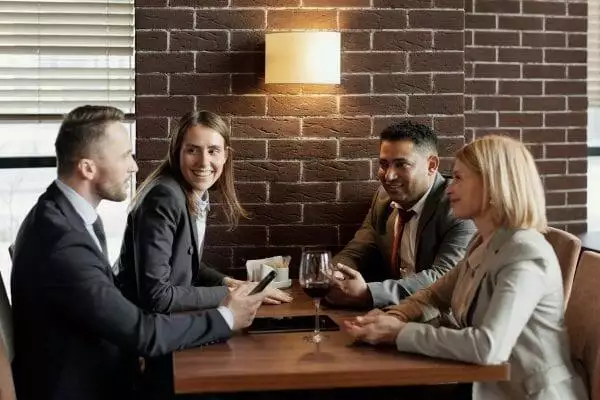 How to be Better Than the Average Person? 15 Great Ways 3 coworkers-talking-at-a-cafe-4428041