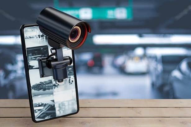 CCTV Security camera on smartphone in parking lot at home resident background. Safe and secure technology inside property and homeowner concept. Copy space. 3D illustration rendering