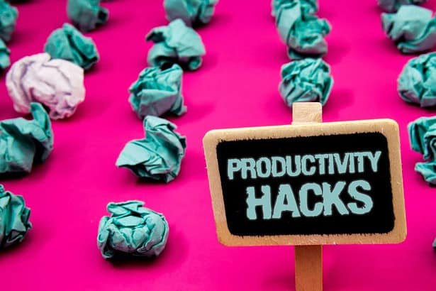 Text sign showing Productivity Hacks. Conceptual photo Hacking Solution Method Tips Efficiency Productivity Blackboard with white letter pink base much green paper lobs big white lob.