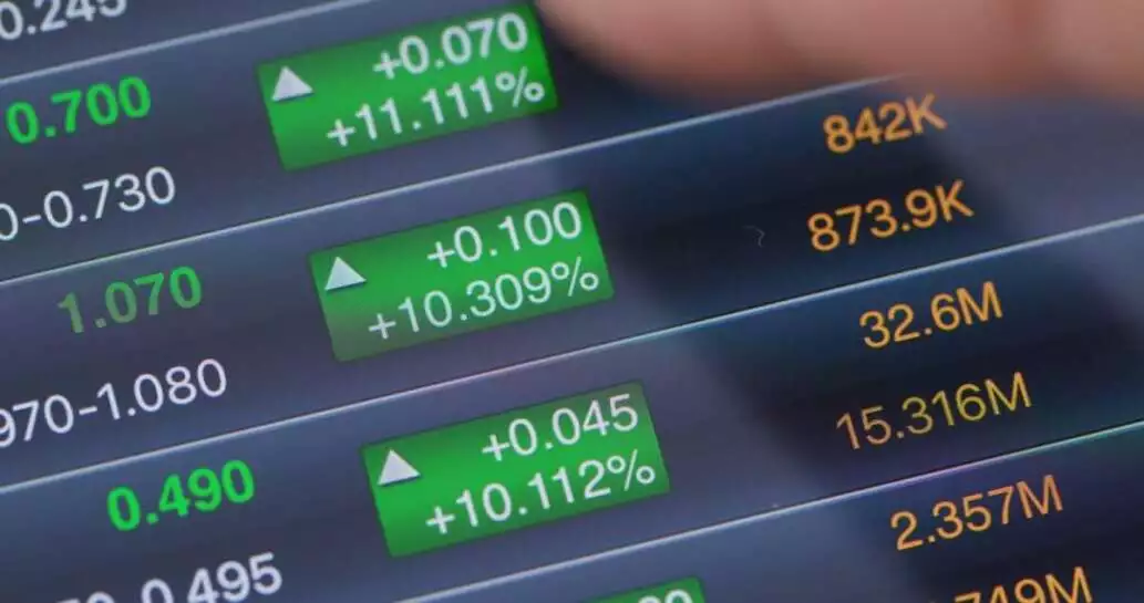 Digital tablet computer showing stock market data graph.