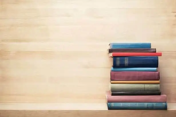 Old Books On A Wooden Shelf