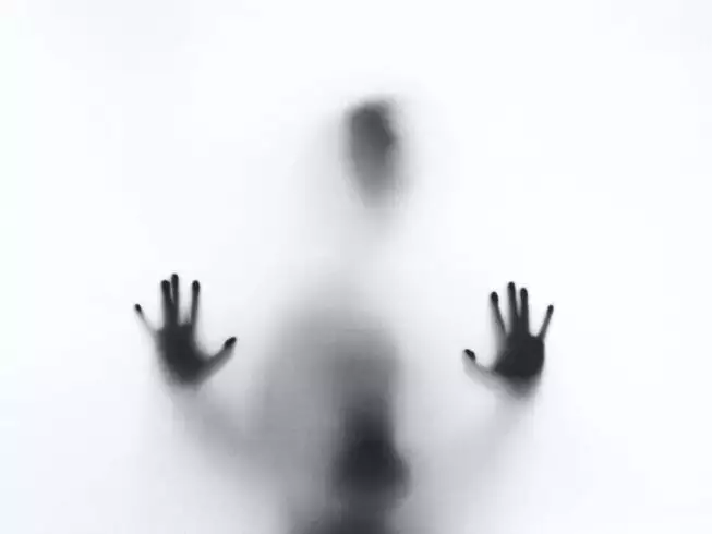 7 Serious Depression Symptoms in Women You Should Look Out For 2 Silhouette of man behind glass