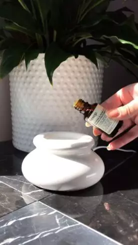 Does Tea Tree Oil Help with Acne? 101 Genuine Ways 2 TEA TREE OIL IN WHITE CERAMIC