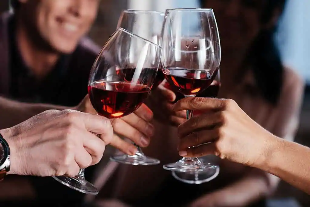 Friends drinking from wine glasses. 