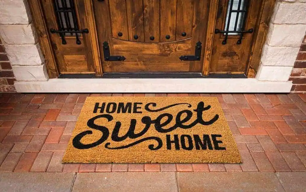 Home Sweet Home Welcome Mat At Custom Front Door of House. 