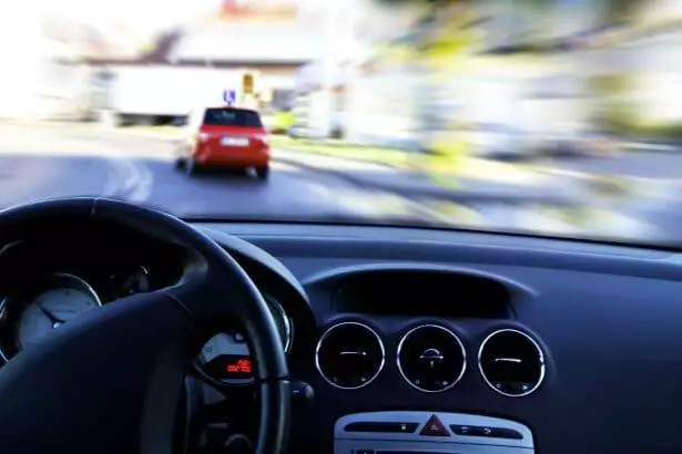 Driving in a car.