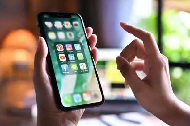 Woman holding a phone.