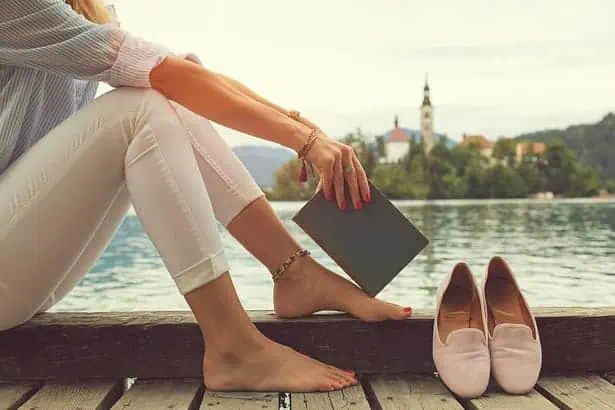 Woman lying by the lakeside.