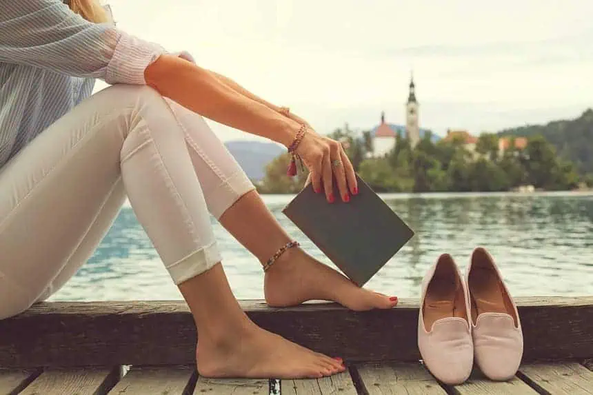 Woman lying by the lakeside.