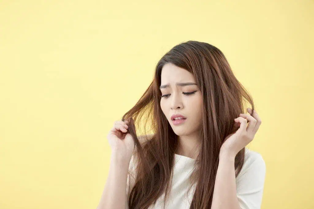 Exploring the Impact of Hard Water on Hair Loss 5 Girl with damaged hair