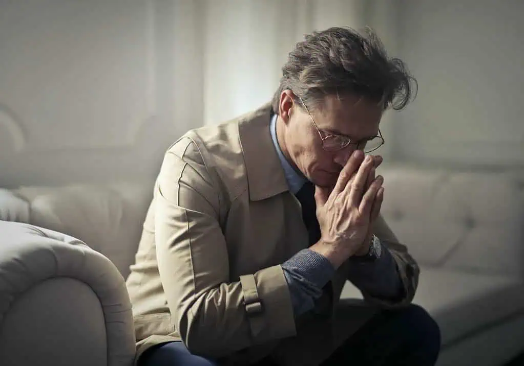How To Write A Condolence Message: 120+ Examples 3 A sad mature man thinking