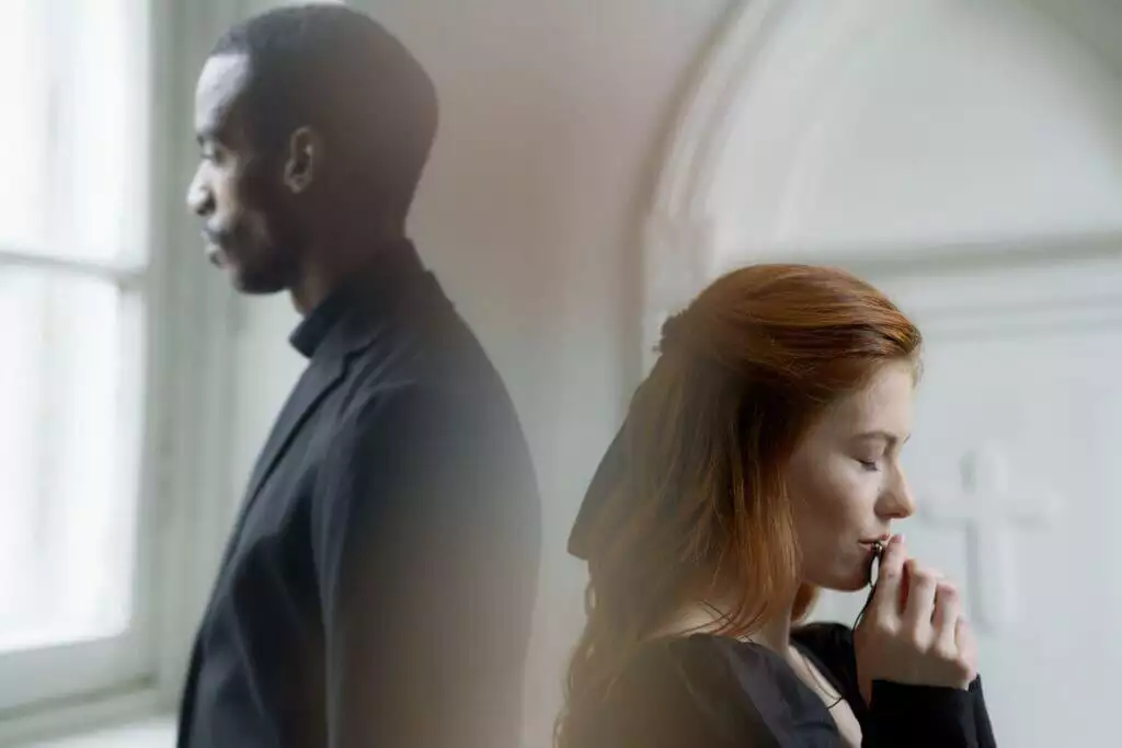 How To Write A Condolence Message: 120+ Examples 2 A man and a woman standing back to back