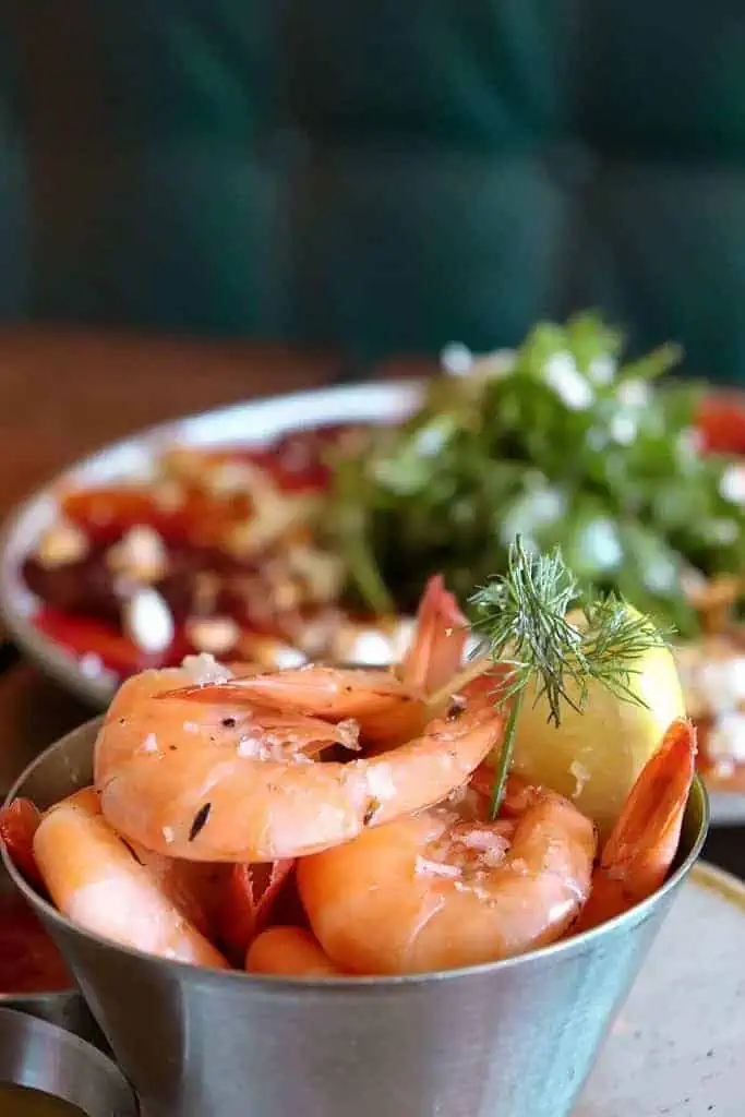 shrimp with lemon and basil seasoning in a bowl